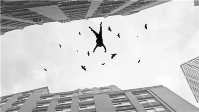 مصرع شاب إثر سقوطه من أعلى عقار بالطالبية وجهود لكشف ملابسات الواقعة