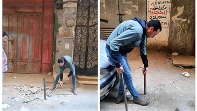 حملة نظافة وإزالة حواجز حديدية لأماكن انتظار السيارات ببولاق الدكرور